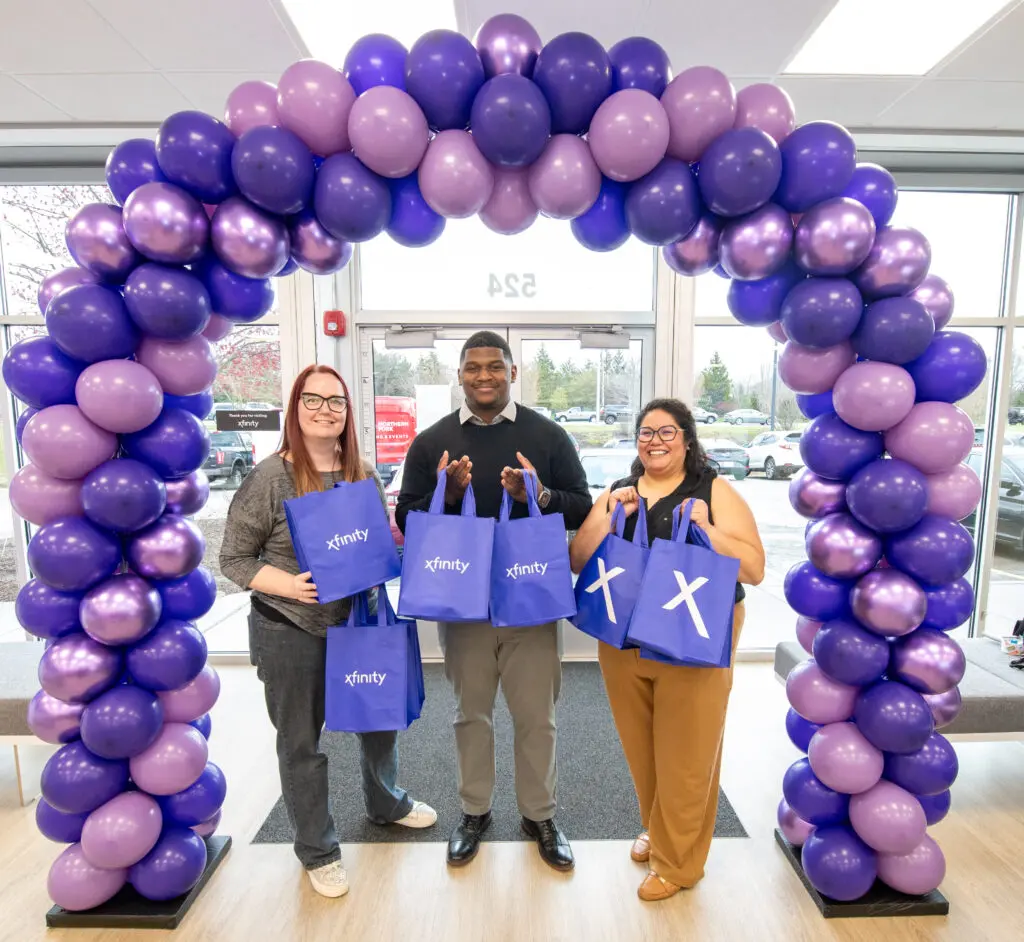 Comcast employees eagerly greet guests for the new Xfinity store in Elgin to help connect customers to fast fiber Internet.