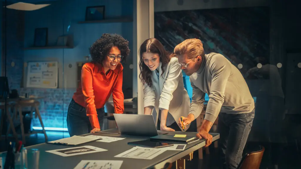 Image of employees utilizing business internet during meetings for fast and reliable business connectivity.