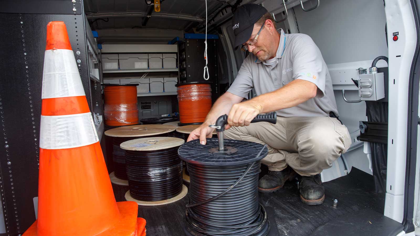 Tech in truck with fiber