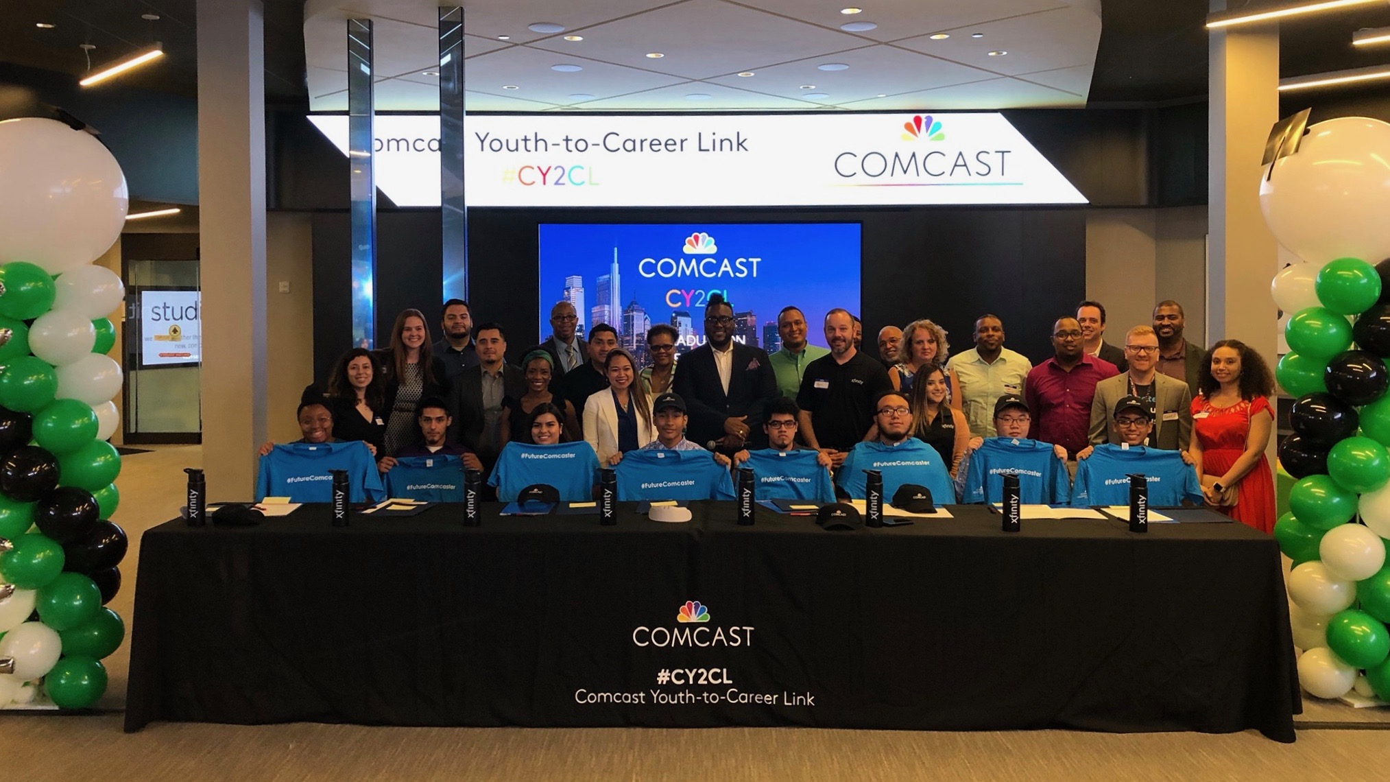 Participants in the “Youth-to-Career Link” (CY2CL) program sit at a long table.