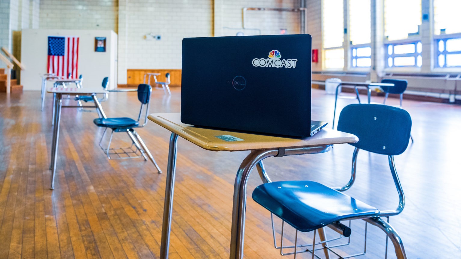 A desk and laptop inside a Lift Zone community center.