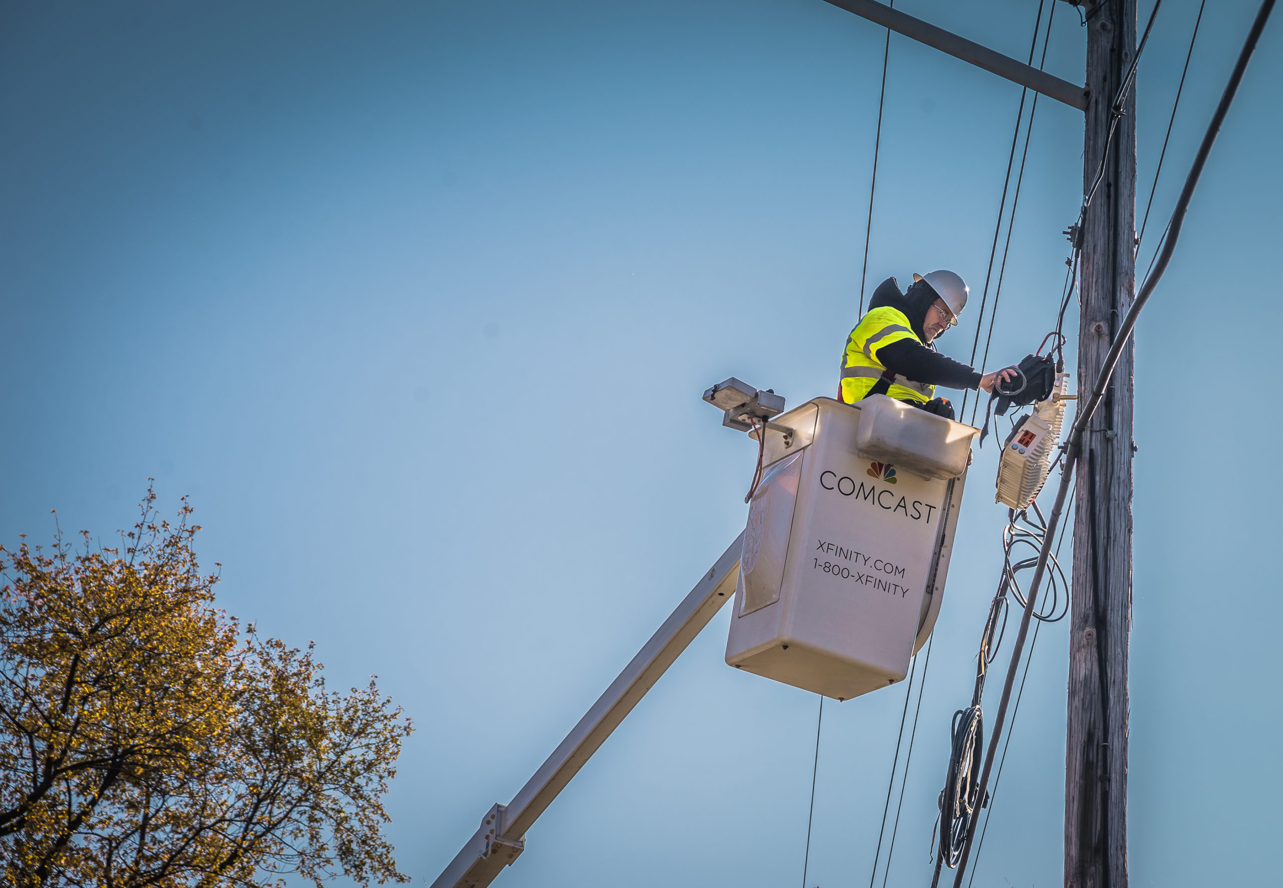 Xfinity response team member working on the network to restore connectivity.