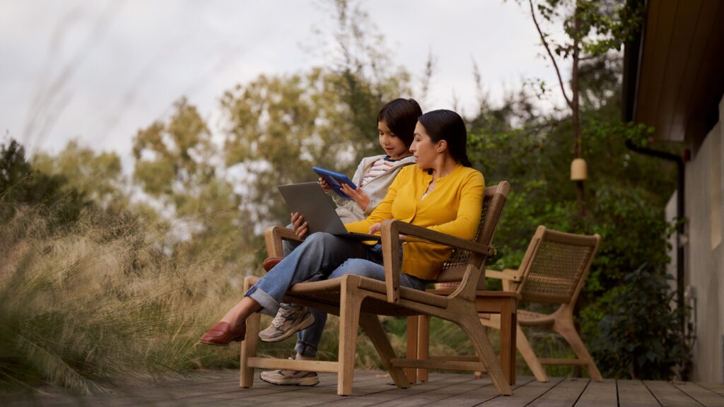 woman and child watching shows on tablets