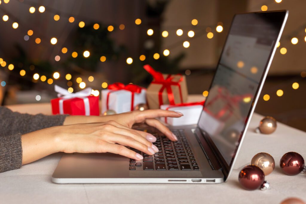 person types on a laptop looking at cybersecurity tips