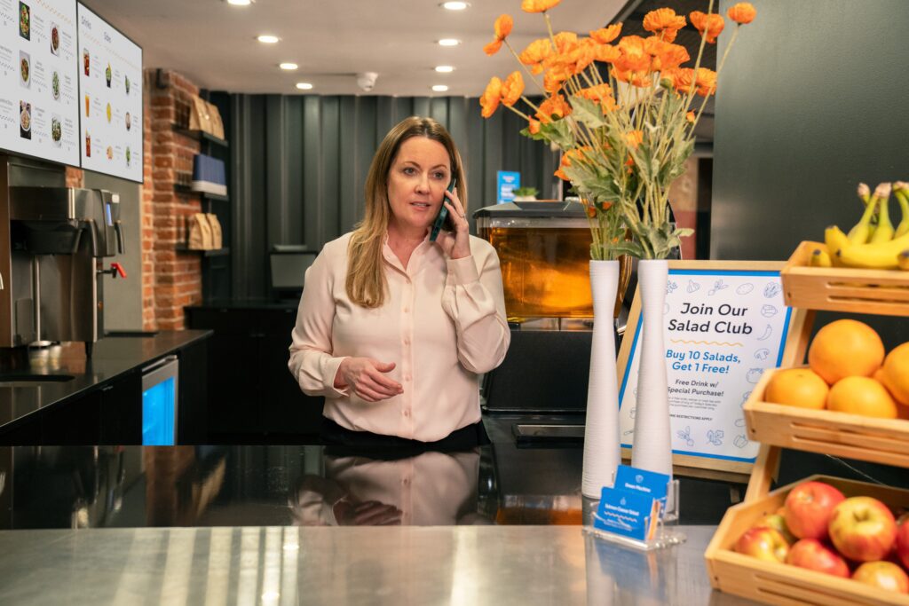 Cafe owner makes phone call using Comcast Business Mobile